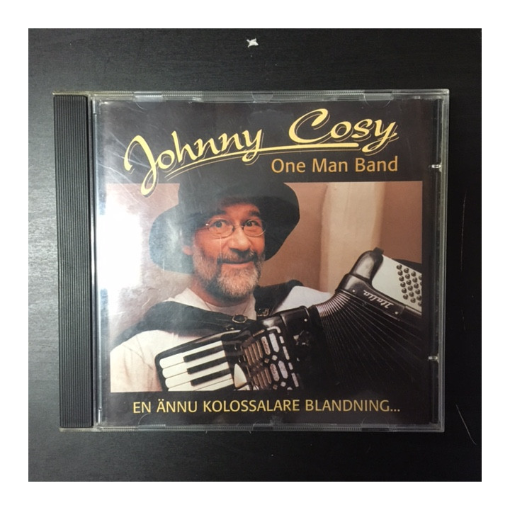 Johnny Cosy - En ännu kolossalare blandning... CD (VG/VG+) -folk-